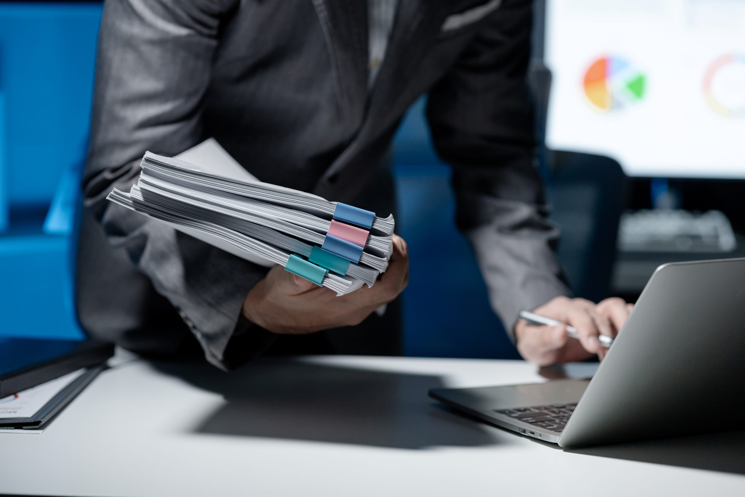 employee-checking-important-details-of-document-on-2025-01-16-21-50-25-utc